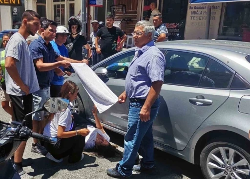 Vatandaşlar yaralı kadın sürücüyü güneşten havluyla korudu

